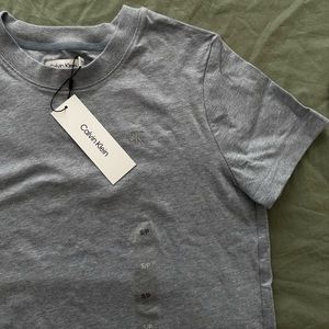 Women’s top color: light blue- Size: S - Brand: Calvin Klein